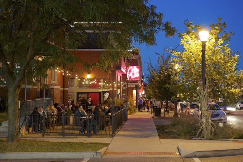 Outdoor dining at a restaurant during evening.