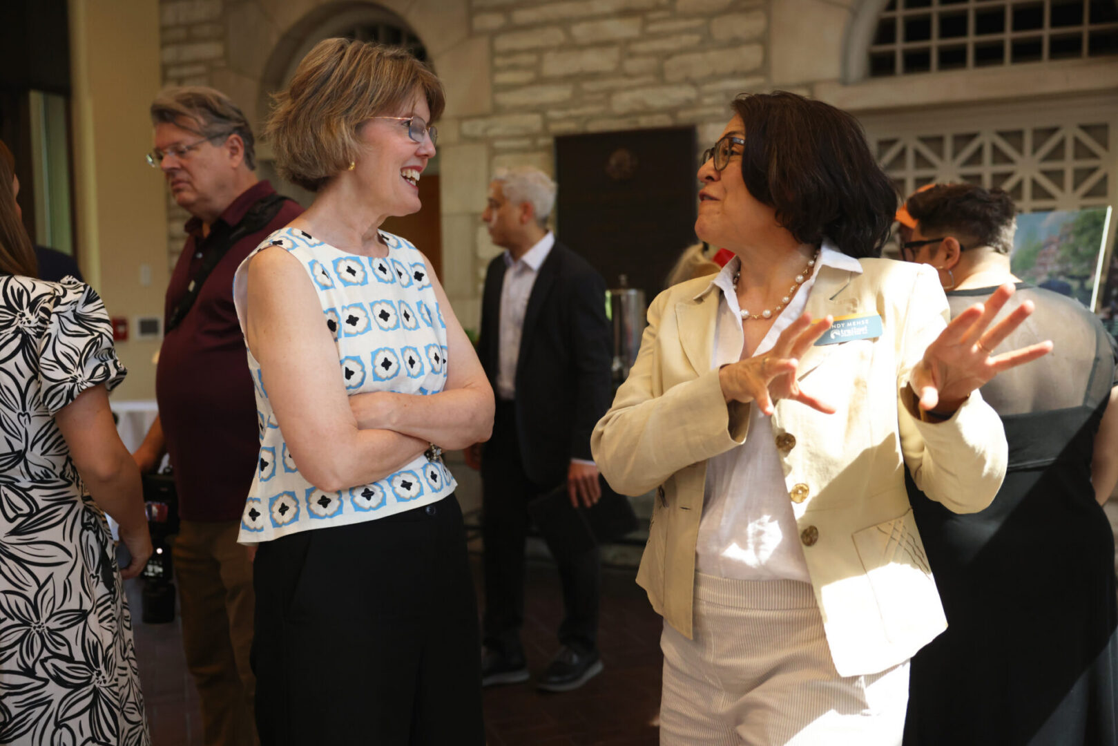 Two women engaged in animated conversation.