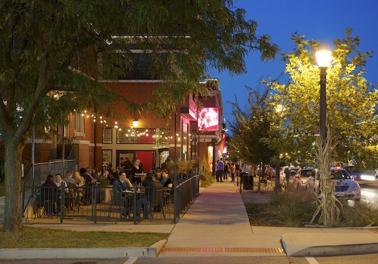 Outdoor dining at a restaurant during evening.